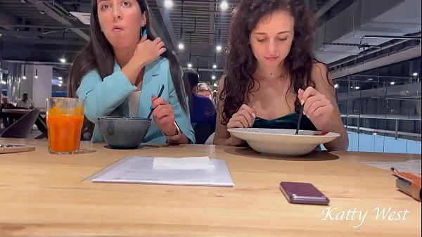 Two shameless chicks have lunch without panties at the mall in public