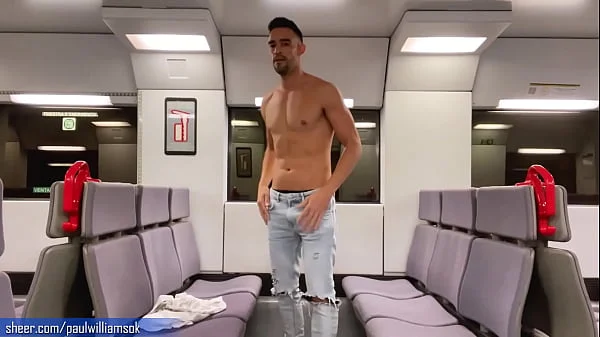 Sexy tanned man travelling naked by train. Very risky public nudity