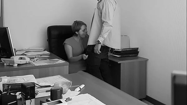 The boss fucks his employer at the office table and films it on hidden cam