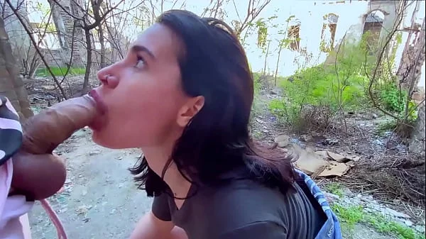 Sucking in public outdoors near people and getting hot sticky cum in her mouth